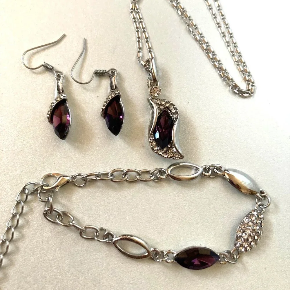 NWOT dark violet crystal earrings, necklace, and bracelet jewelry set